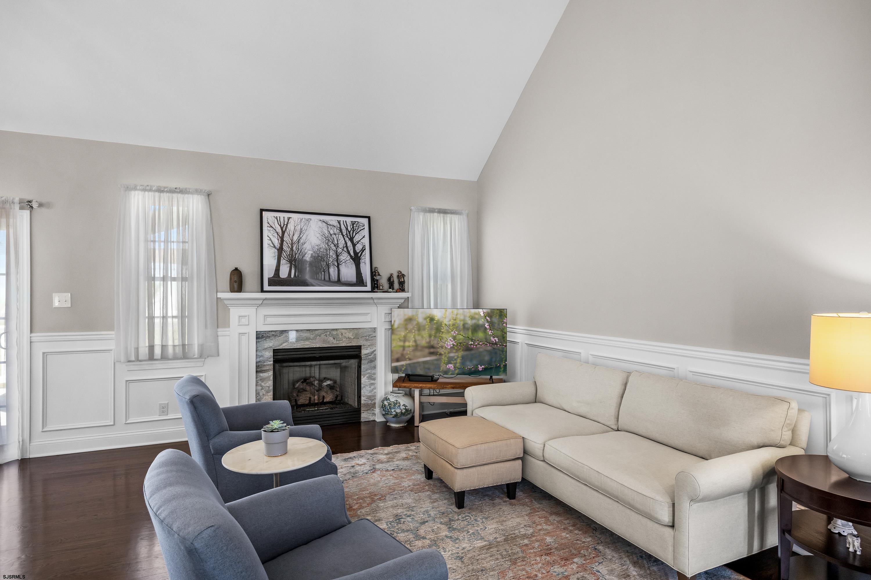 215 Surf Road Egg Harbor Township, NJ 08234 - Photo 6 of 31 a living room with furniture and a fireplace