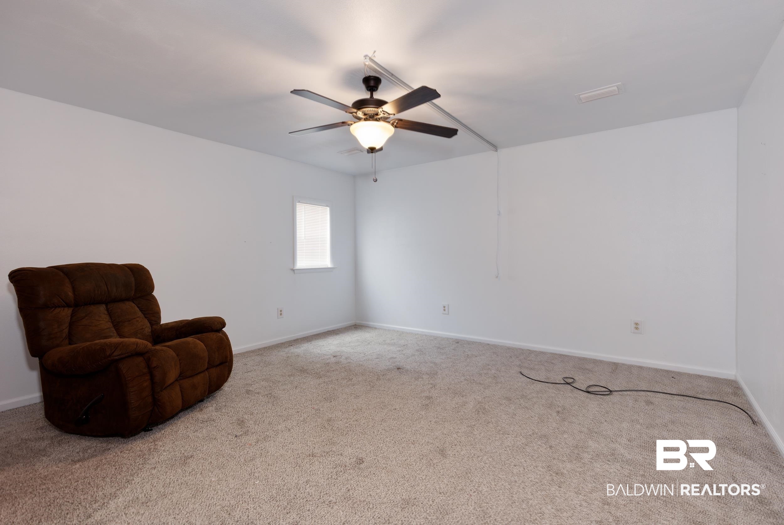 6725 Upper Creek Road Flomaton, AL 36441 - Photo 60 of 61 Unfurnished room featuring carpet, a ceiling fan, and baseboards
