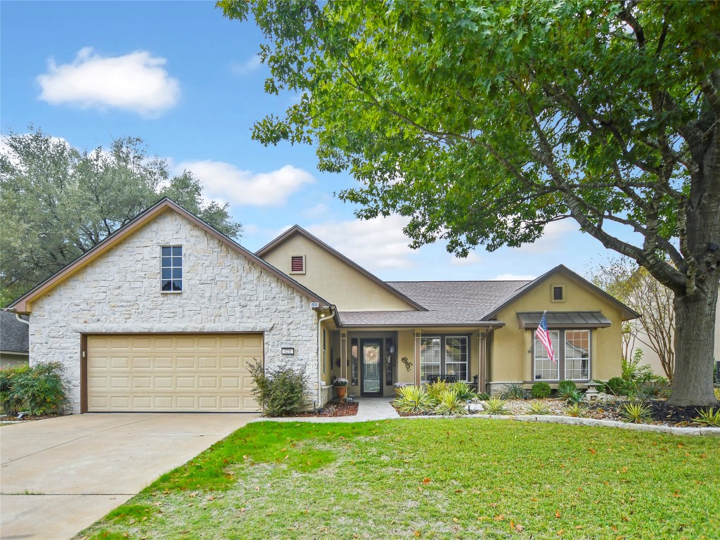 a front view of house with yard and green space
