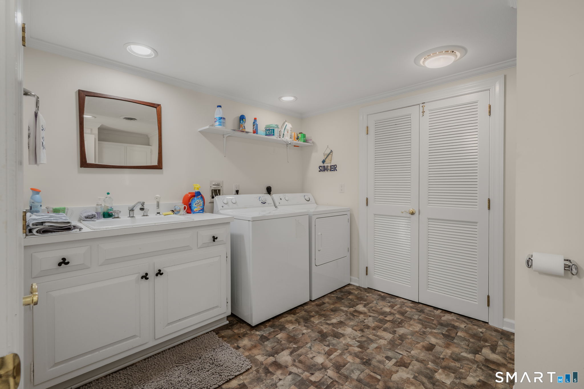 77 Essex Road Old Saybrook, CT 06475 - Photo 33 of 36 Lower level laundry center and full bath combo.