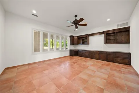a spacious bathroom with a tub sink and mirror