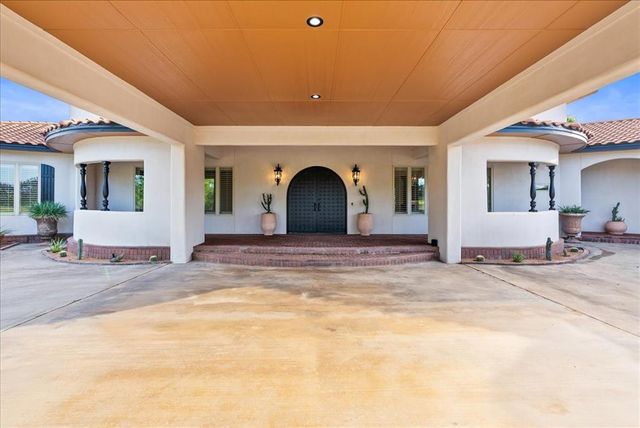 a view of a livingroom with a patio and a yard