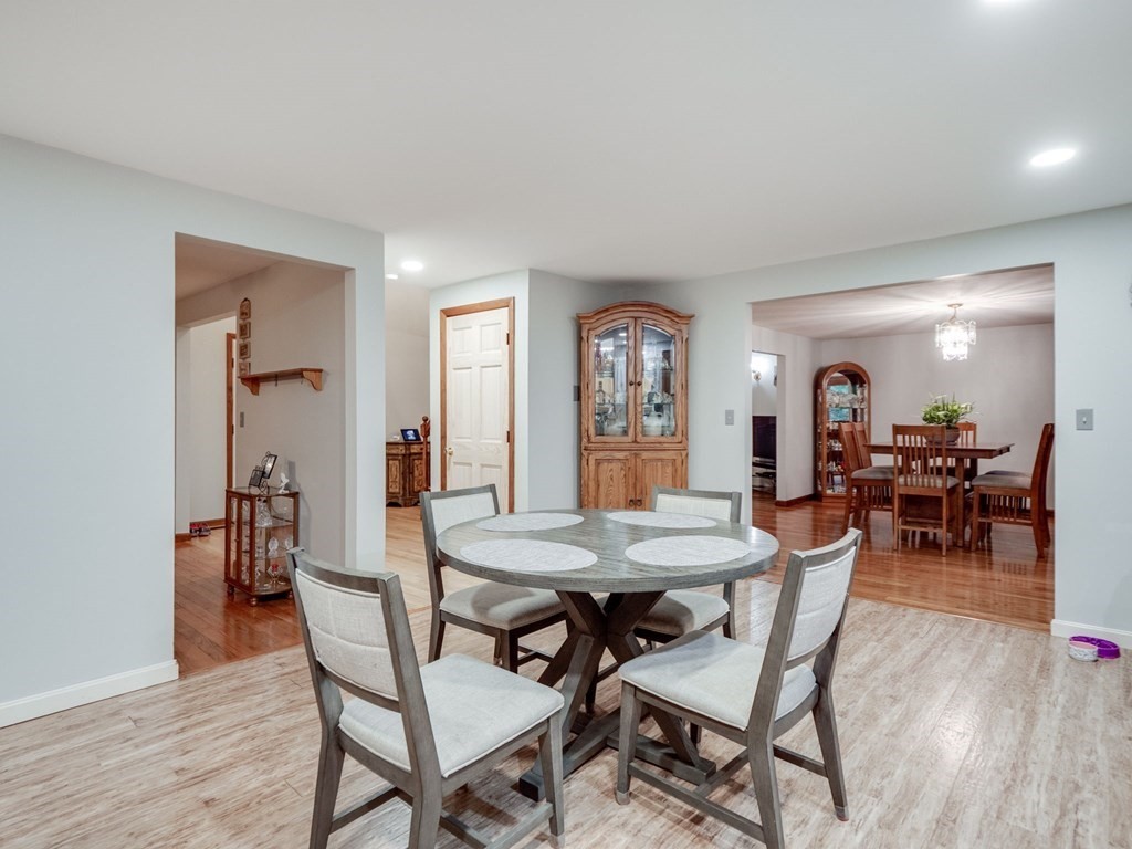 145 Coburn Road Tyngsborough, MA 01879 - Photo 14 of 41 a view of a dining room with furniture and wooden floor