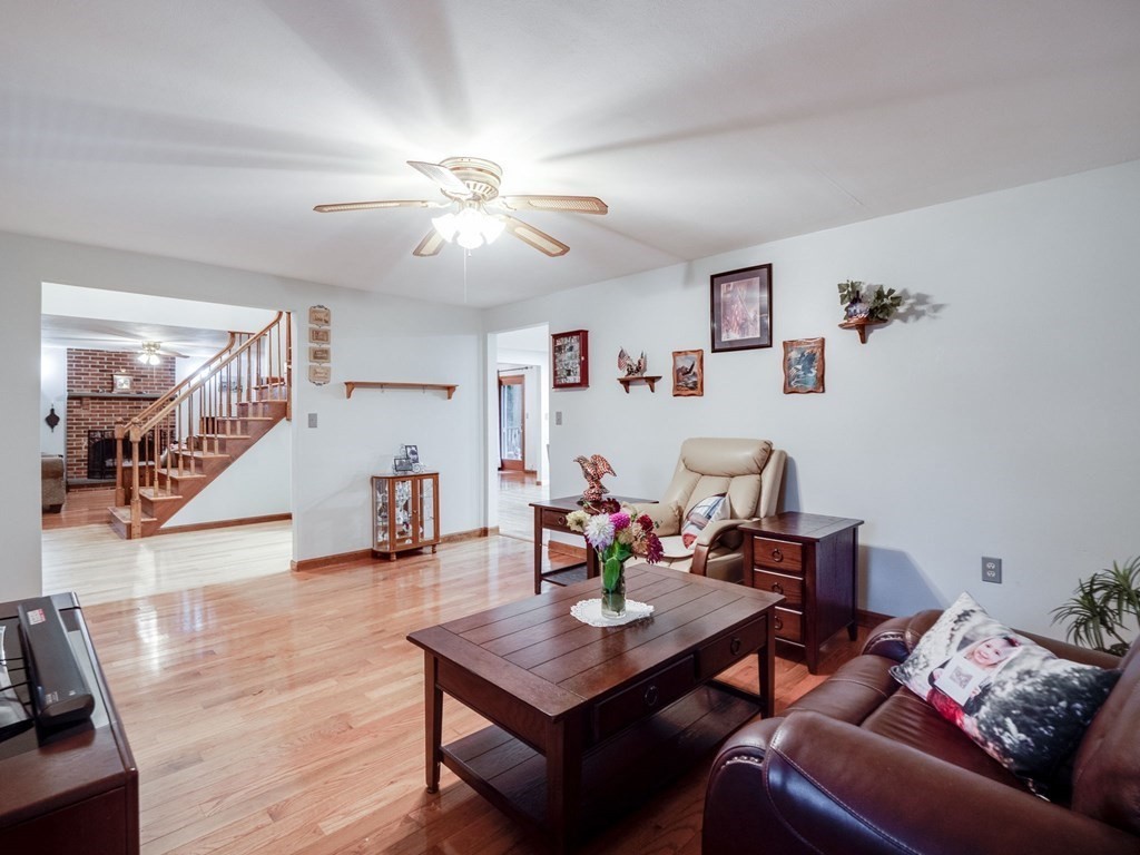 145 Coburn Road Tyngsborough, MA 01879 - Photo 17 of 41 a living room with furniture and wooden floor