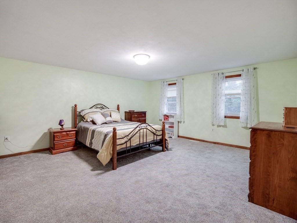 145 Coburn Road Tyngsborough, MA 01879 - Photo 20 of 41 a bedroom with a bed and window