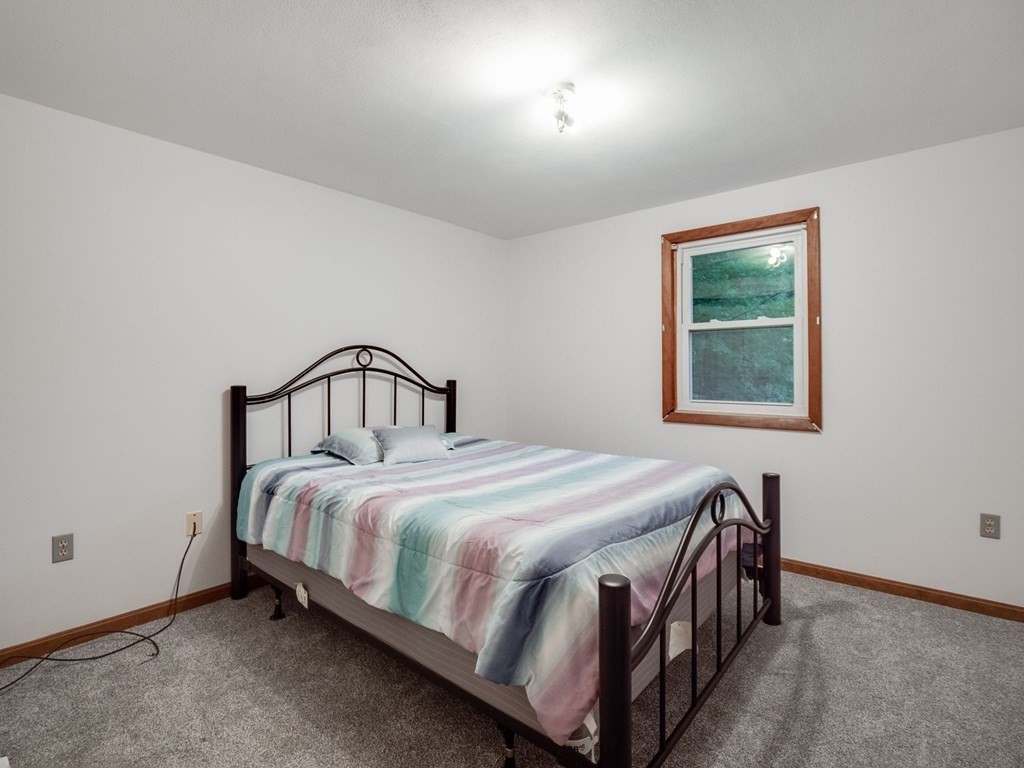 145 Coburn Road Tyngsborough, MA 01879 - Photo 25 of 41 a bedroom with a bed and a window