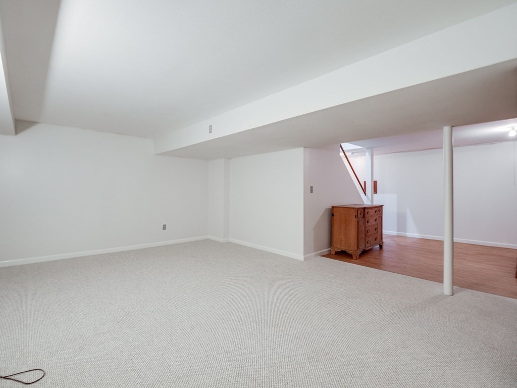 145 Coburn Road Tyngsborough, MA 01879 - Photo 34 of 41 a view of an empty room with a window