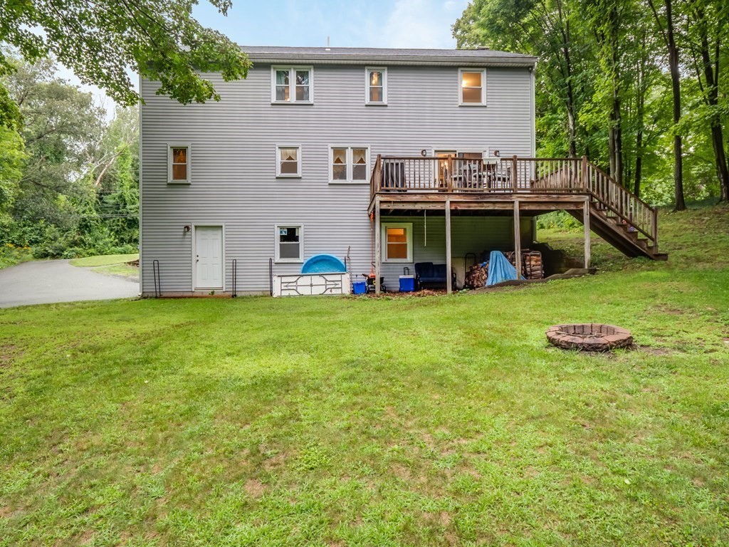 145 Coburn Road Tyngsborough, MA 01879 - Photo 36 of 41 a view of a house with backyard and porch