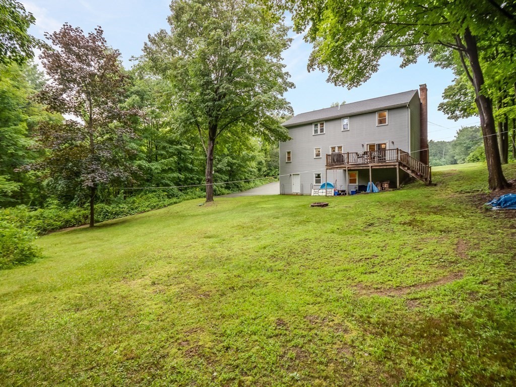 145 Coburn Road Tyngsborough, MA 01879 - Photo 37 of 41 a view of a house with yard and sitting area