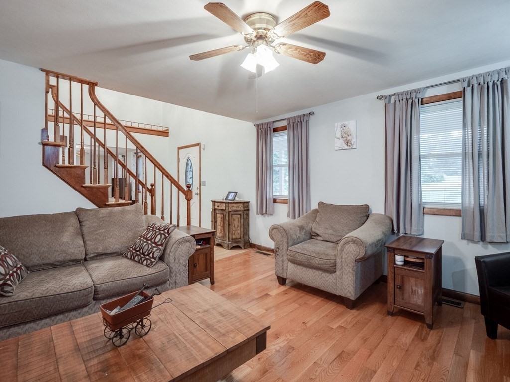 145 Coburn Road Tyngsborough, MA 01879 - Photo 8 of 41 a living room with furniture and a large window