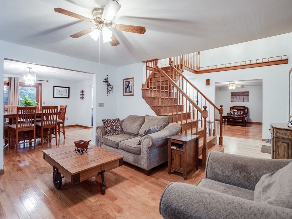 145 Coburn Road Tyngsborough, MA 01879 - Photo 9 of 41 a living room with furniture and wooden floor