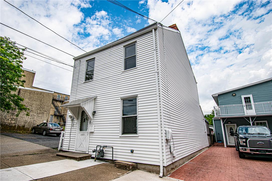 27 West Allen Street Allentown, PA 18102 - Photo 3 of 26 A classic facade with white siding and multiple windows defines this multi-story residence.