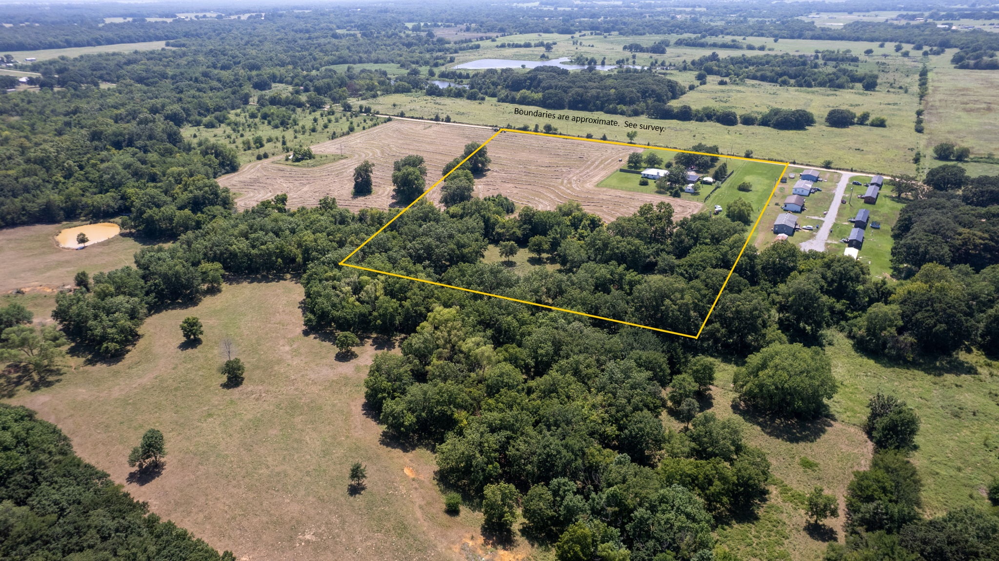 633 Swinney Road Mead, OK 73449 - Photo 27 of 32 Expansive acreage featuring a mix of mature trees and open fields
