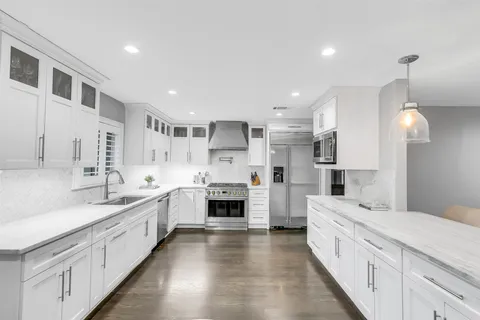a kitchen with a table and chairs in it