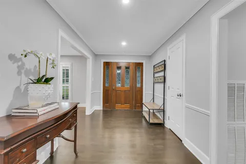 a view of a livingroom with furniture and front door