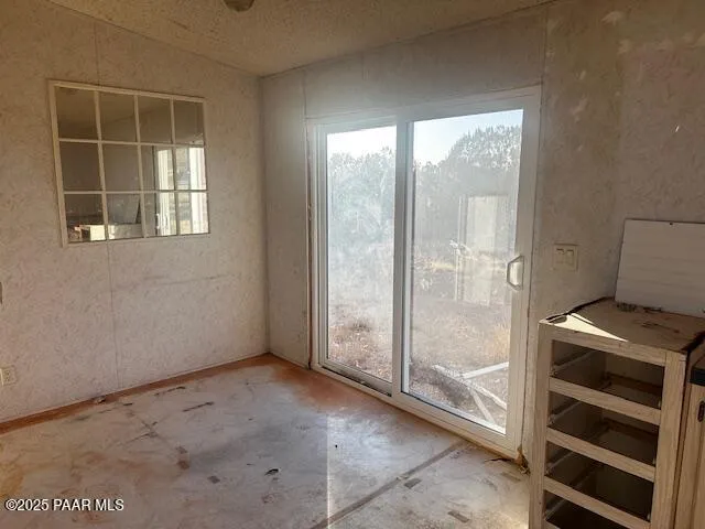 a view of an empty room with a window