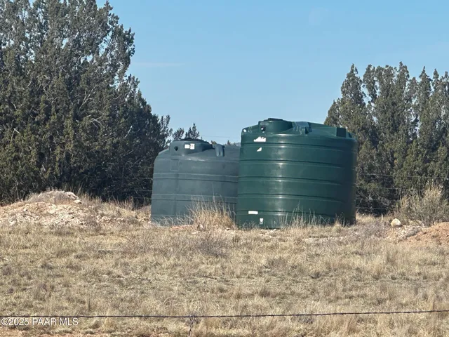 a bathroom with a granite countertop sink and window