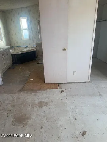 a bathroom with a toilet and a shower curtain