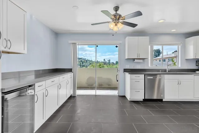a kitchen with a stove a sink and a refrigerator