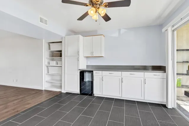 a kitchen with cabinets and window