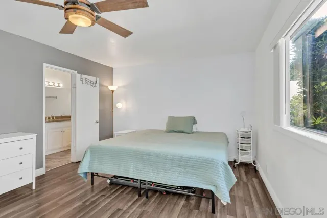 a bedroom with a bed and a dresser