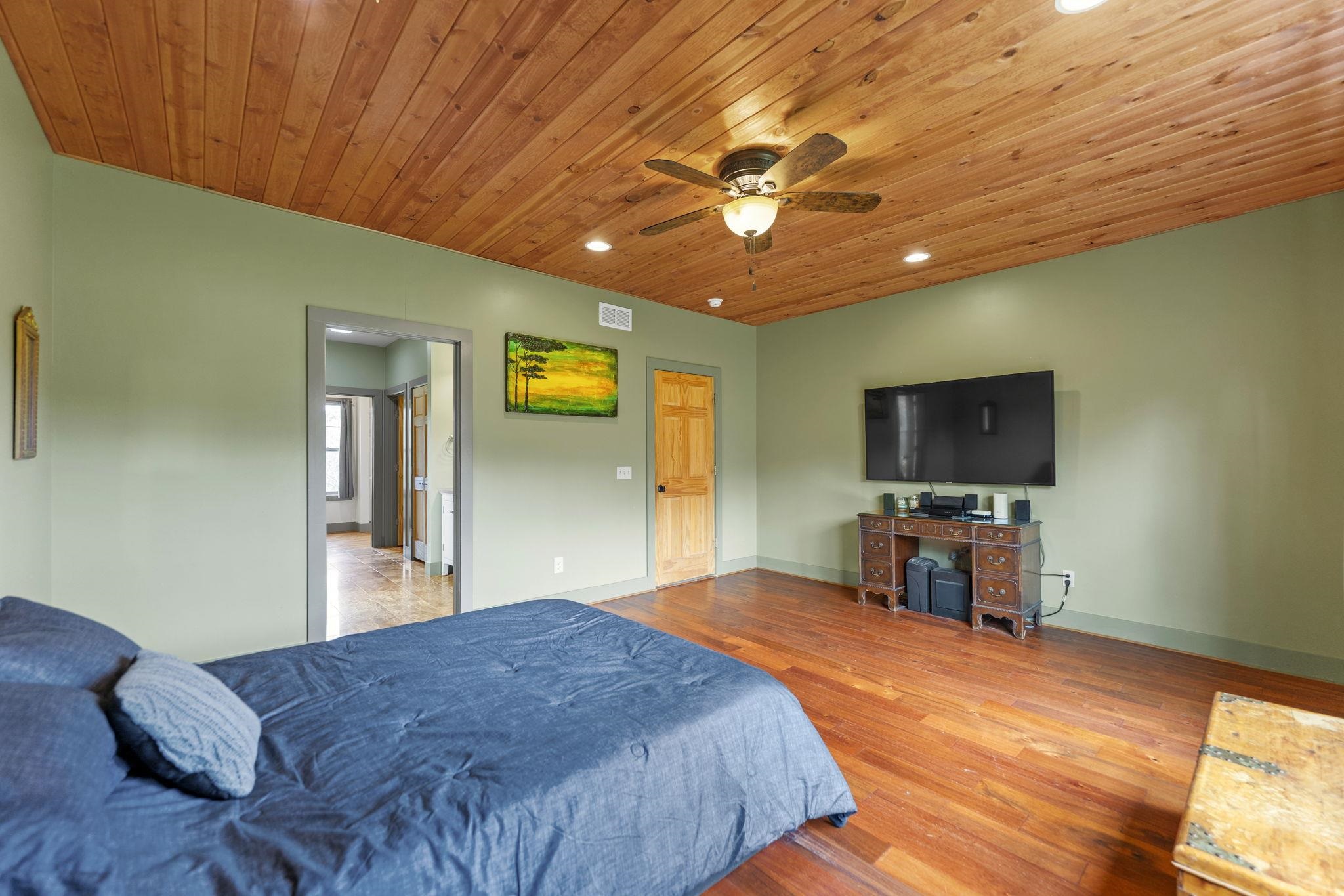 166 South Rocky Hill Road Galena, IL 61036 - Photo 16 of 57 a bedroom with a bed and a flat screen tv