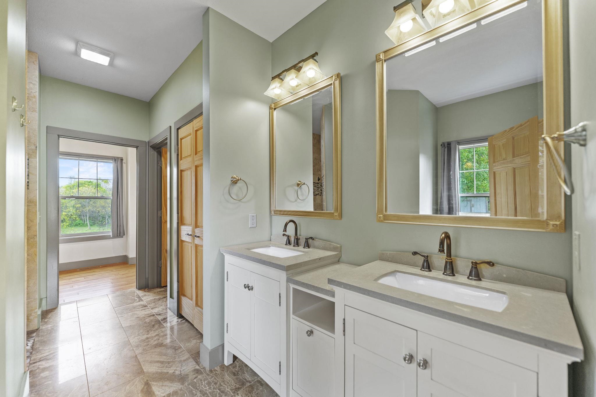 166 South Rocky Hill Road Galena, IL 61036 - Photo 17 of 57 a bathroom with a sink and a mirror