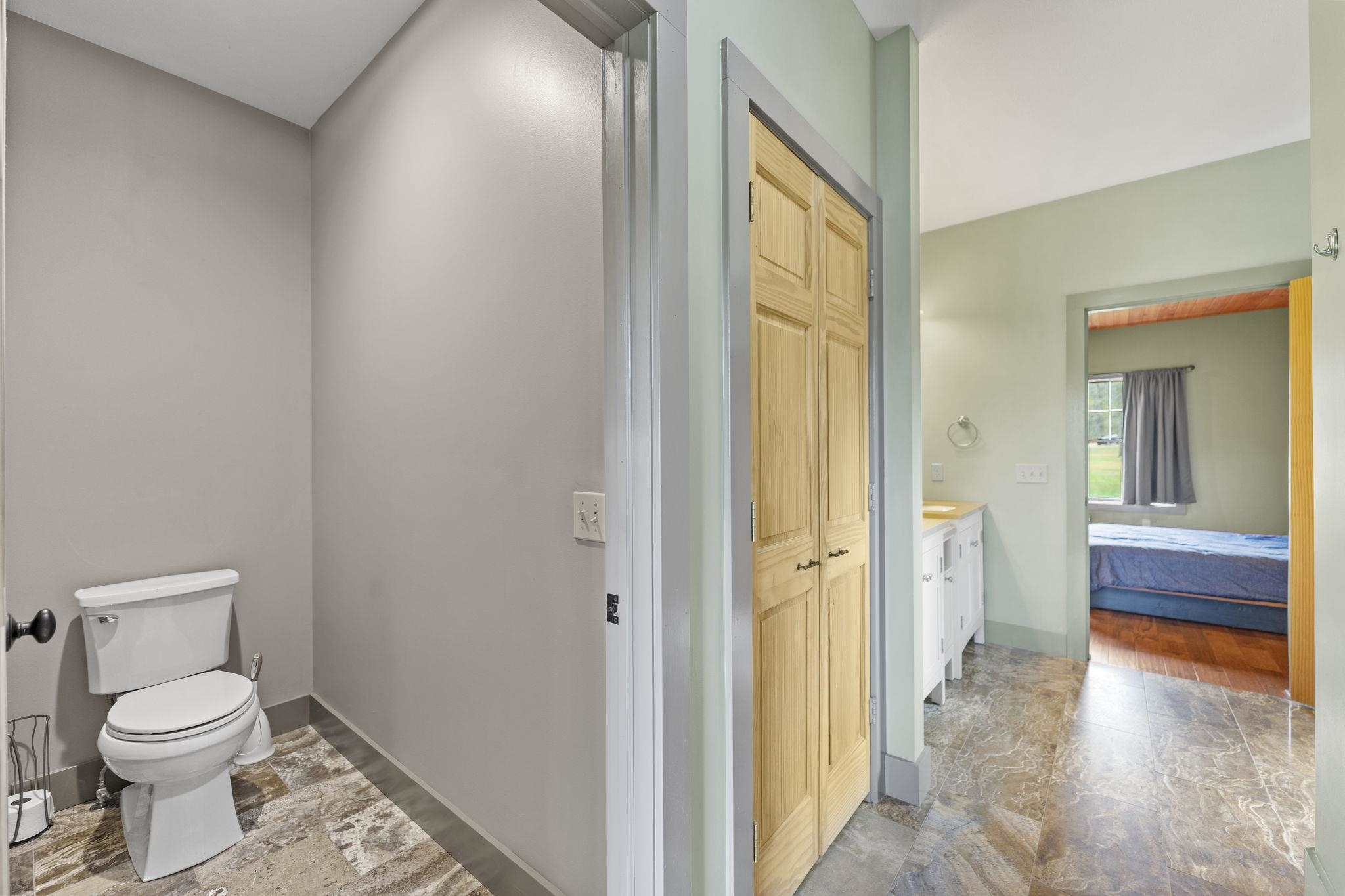 166 South Rocky Hill Road Galena, IL 61036 - Photo 18 of 57 a bathroom with a granite countertop toilet and a sink