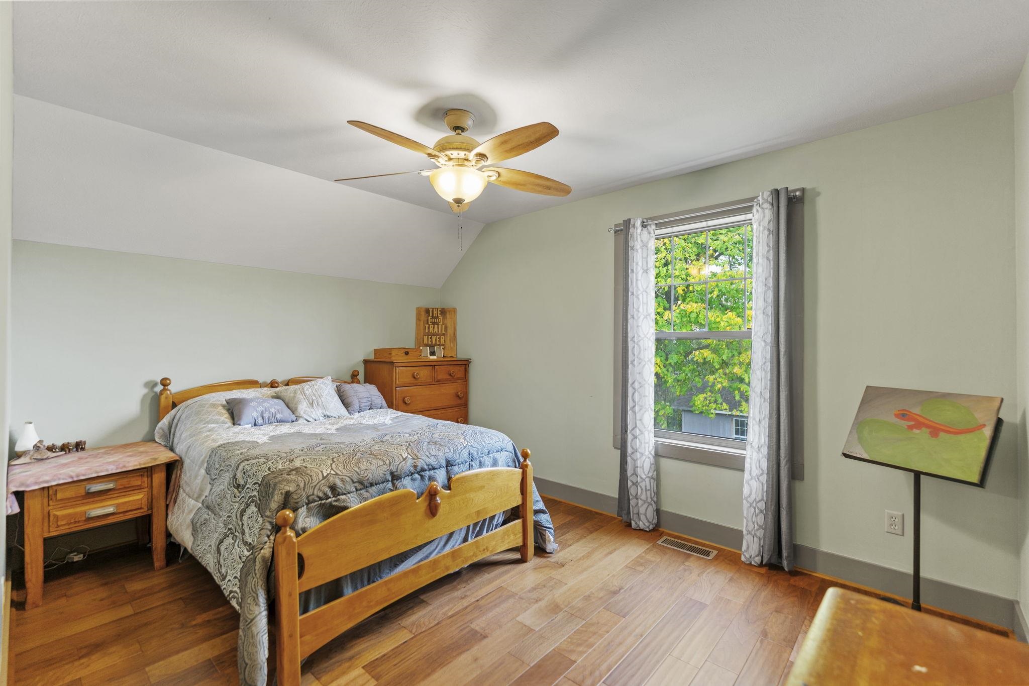 166 South Rocky Hill Road Galena, IL 61036 - Photo 28 of 57 a bedroom with a bed and a chandelier