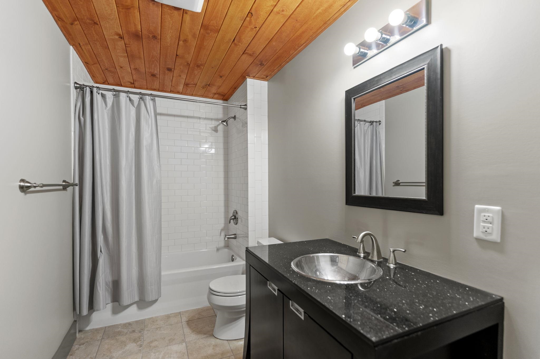 166 South Rocky Hill Road Galena, IL 61036 - Photo 39 of 57 a bathroom with a granite countertop sink toilet and shower