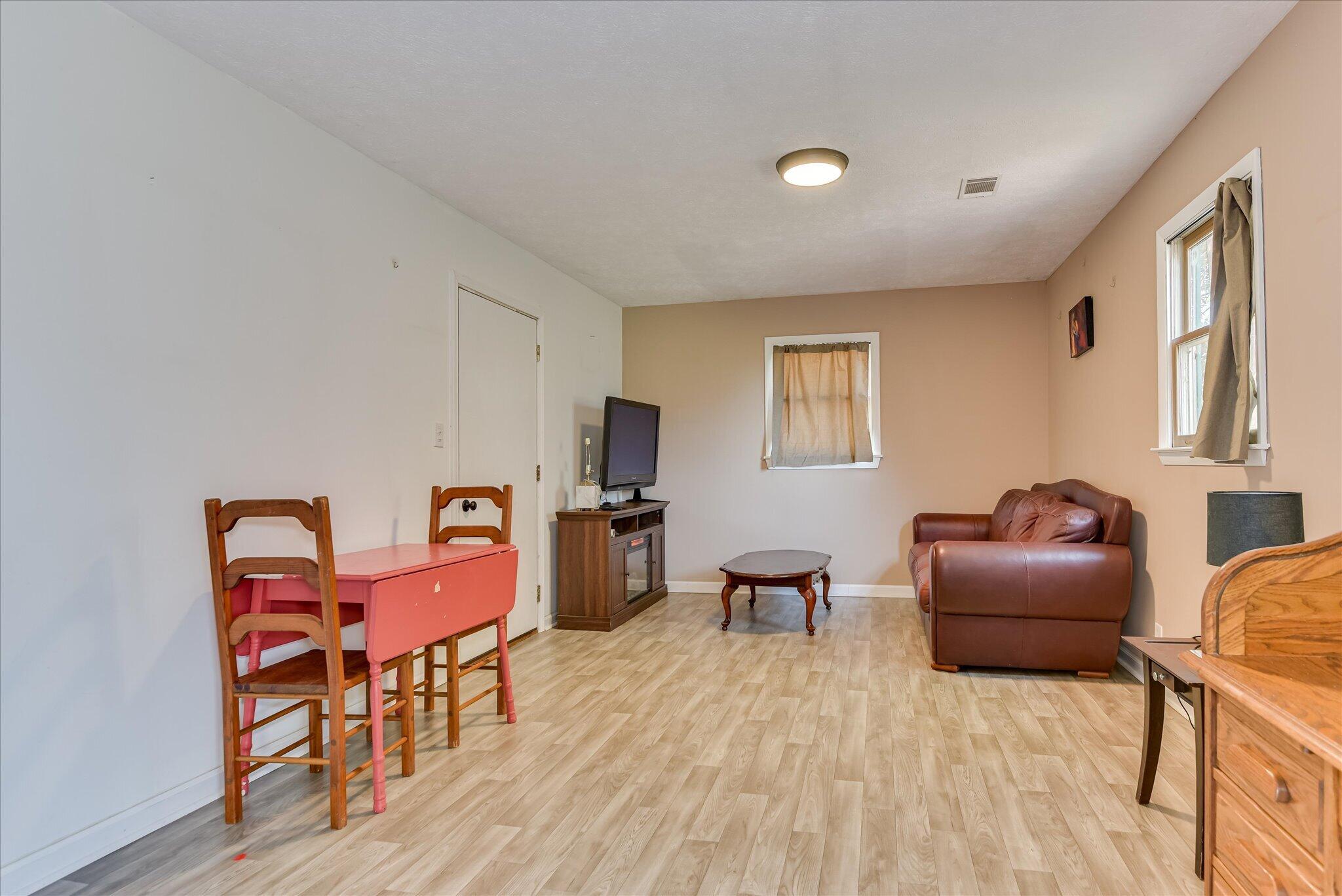 1063 Colbert Bridge Road Aiken, SC 29803 - Photo 40 of 68 a work room with furniture wooden floor and a window