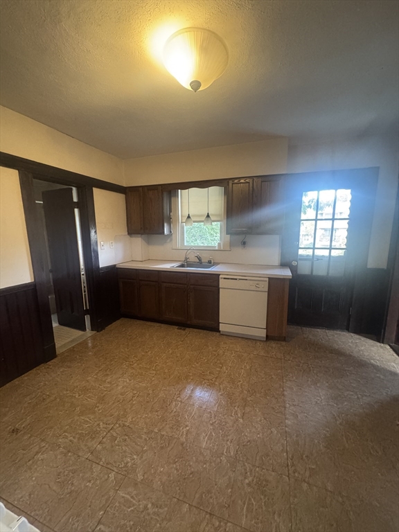 86 Chestnut Street, Unit 2 Brookline, MA 02445 - Photo 8 of 11 a kitchen with refrigerator and window