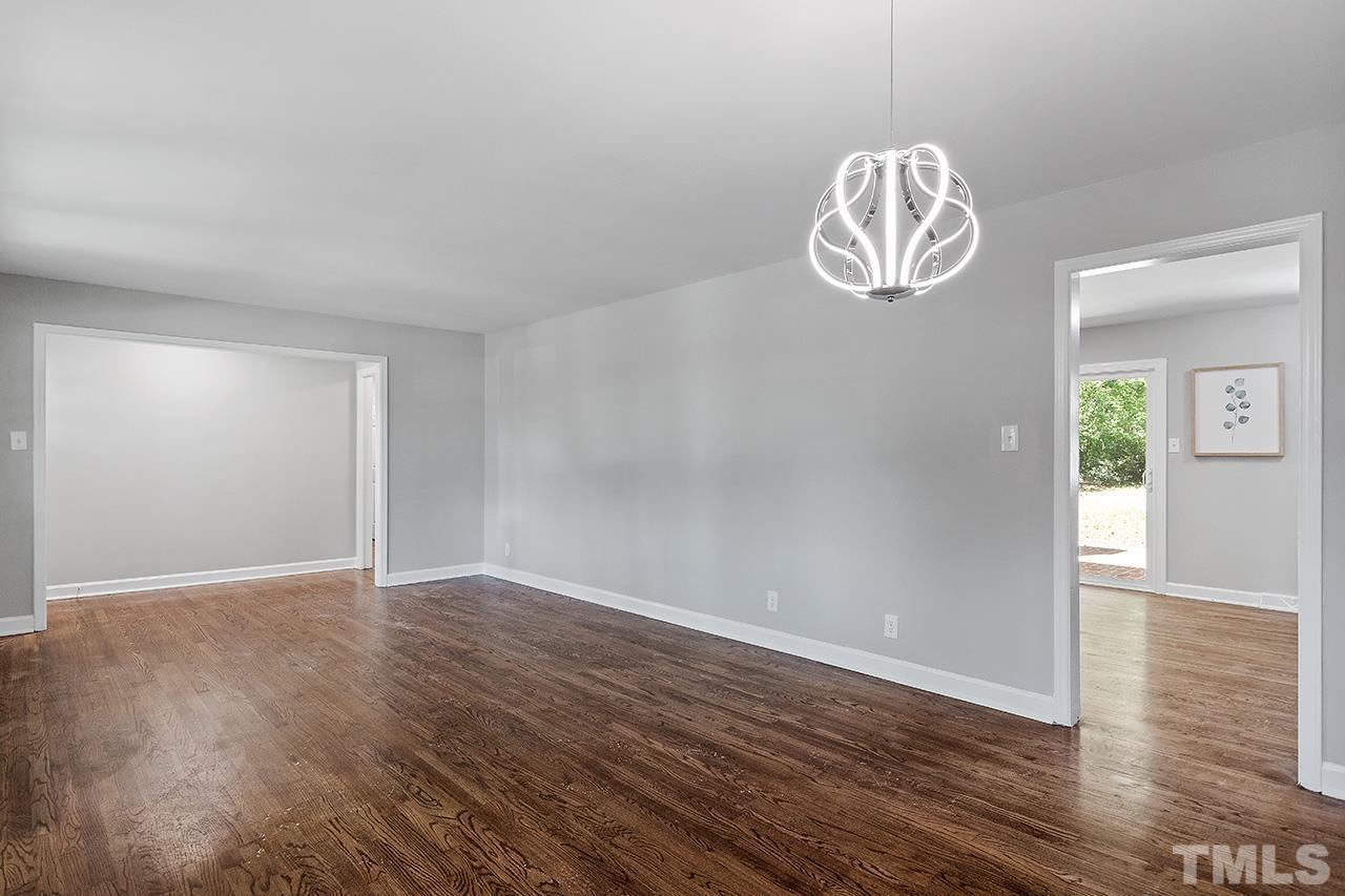 1307 Castlebay Road Durham, NC 27704 - Photo 23 of 41 an empty room with wooden floor