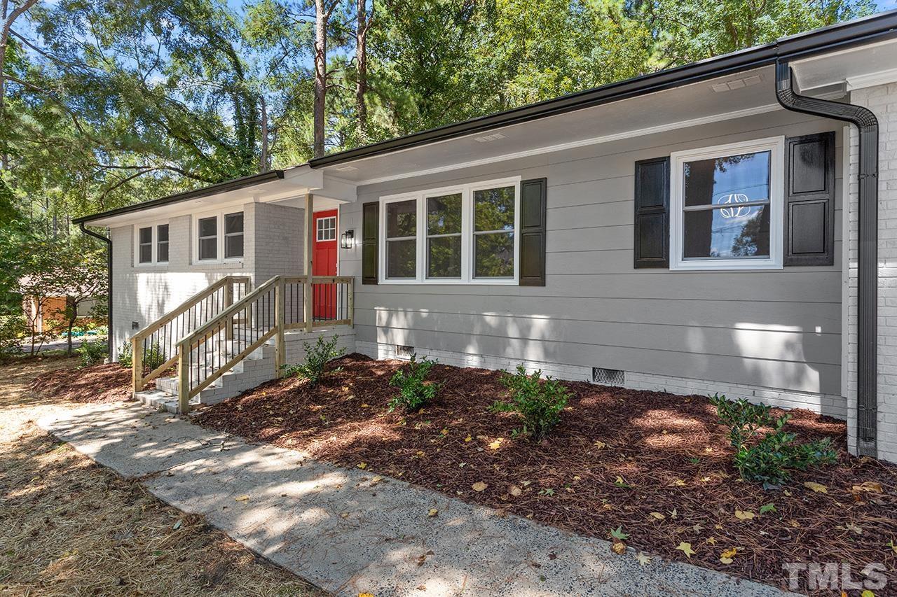 1307 Castlebay Road Durham, NC 27704 - Photo 34 of 41 a front view of a house with garden