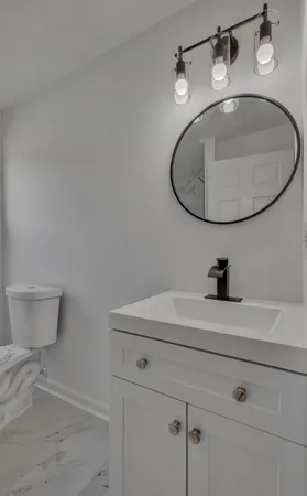 a bathroom with a sink and mirror