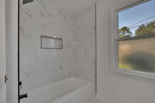 a bathroom with a bathtub