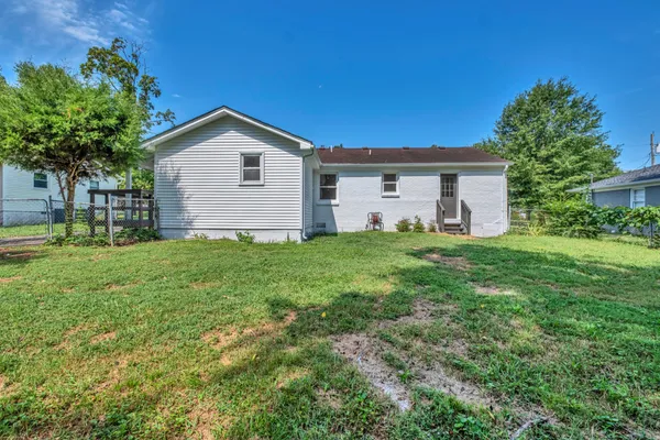 a house view with a garden and yard