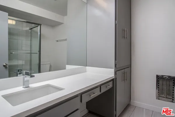 a bathroom with a sink and a mirror