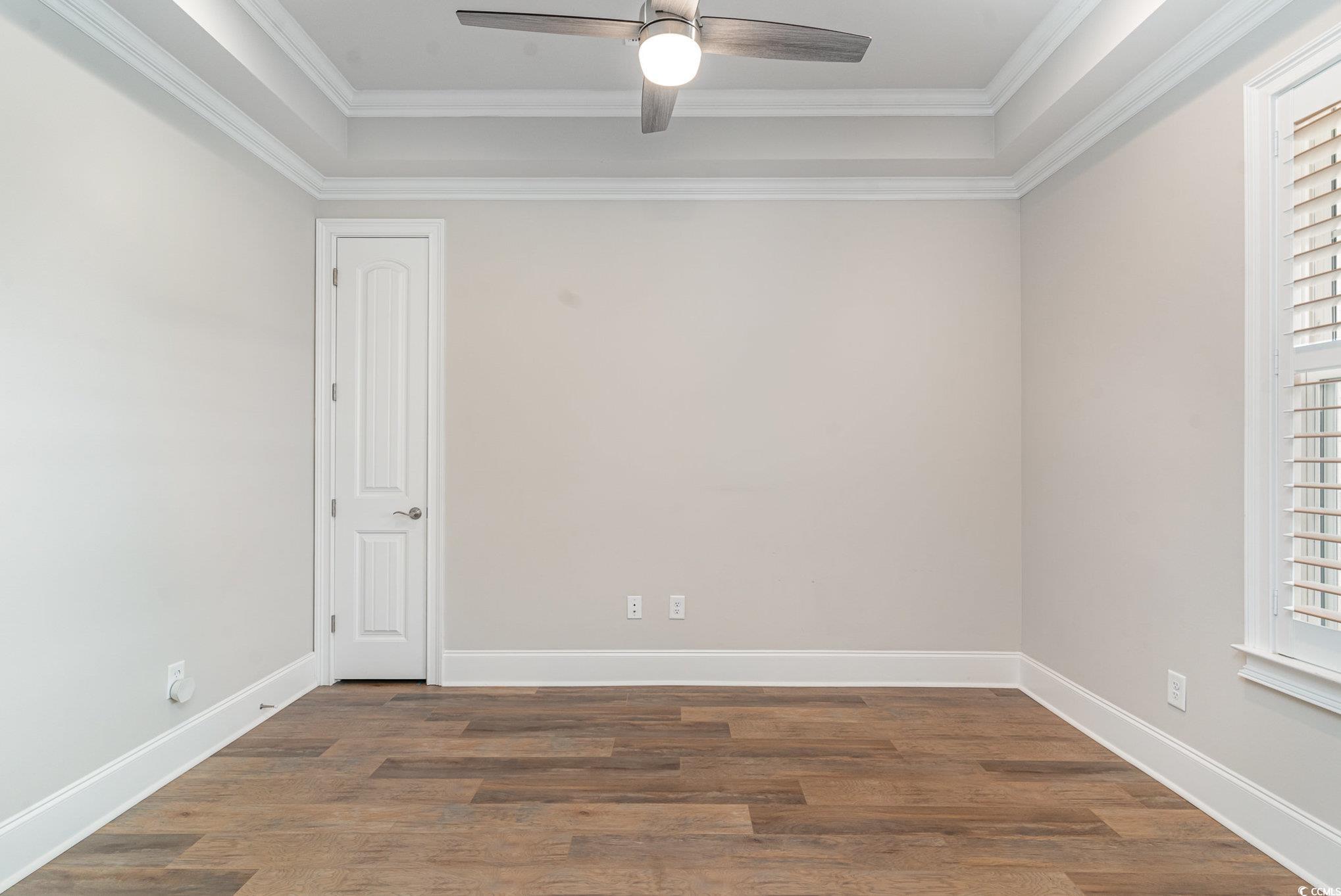 528 Starlit Way Myrtle Beach, SC 29579 - Photo 12 of 40 Empty room with dark wood-type flooring, ornamenta