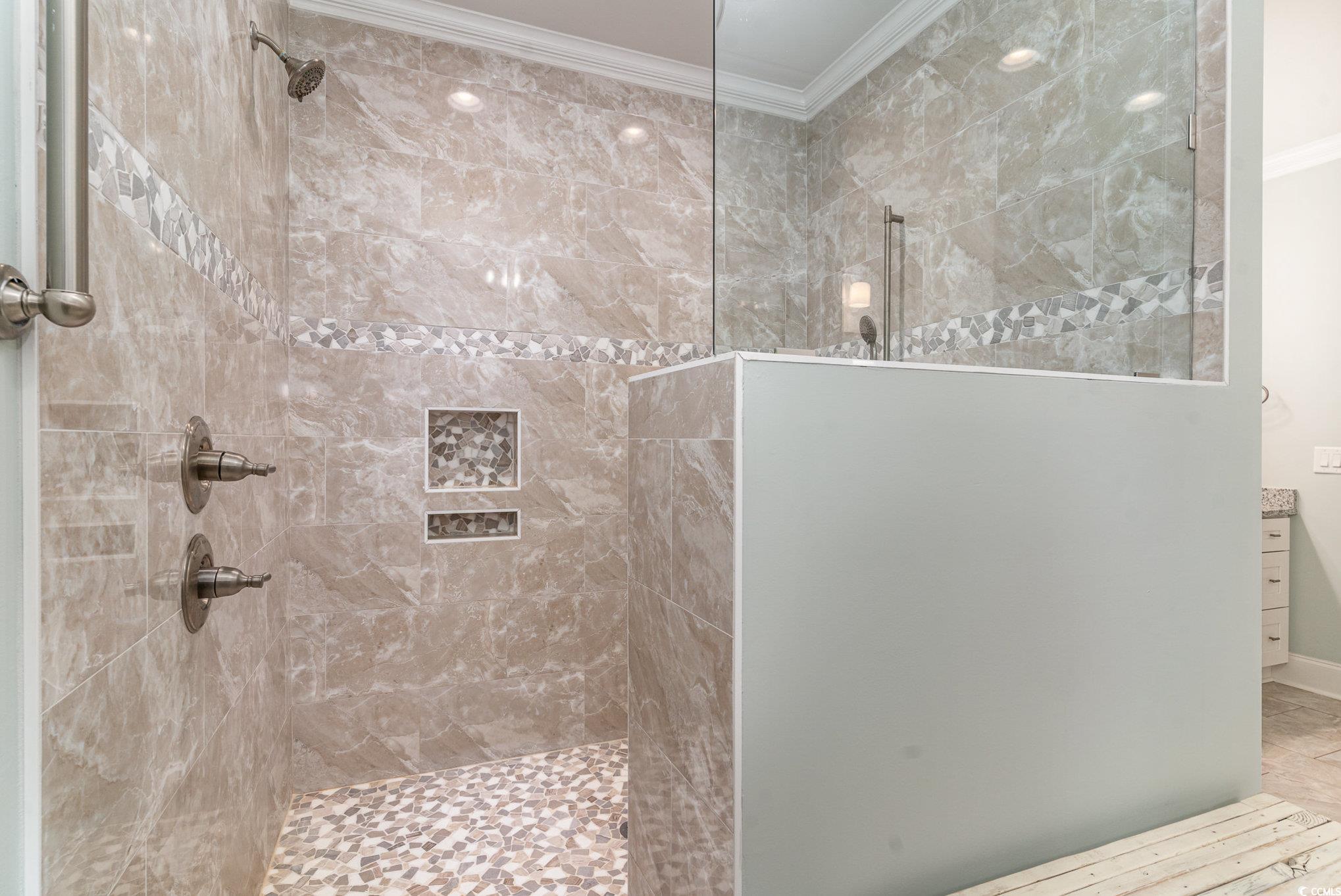528 Starlit Way Myrtle Beach, SC 29579 - Photo 22 of 40 Bathroom with ornamental molding and a tile shower