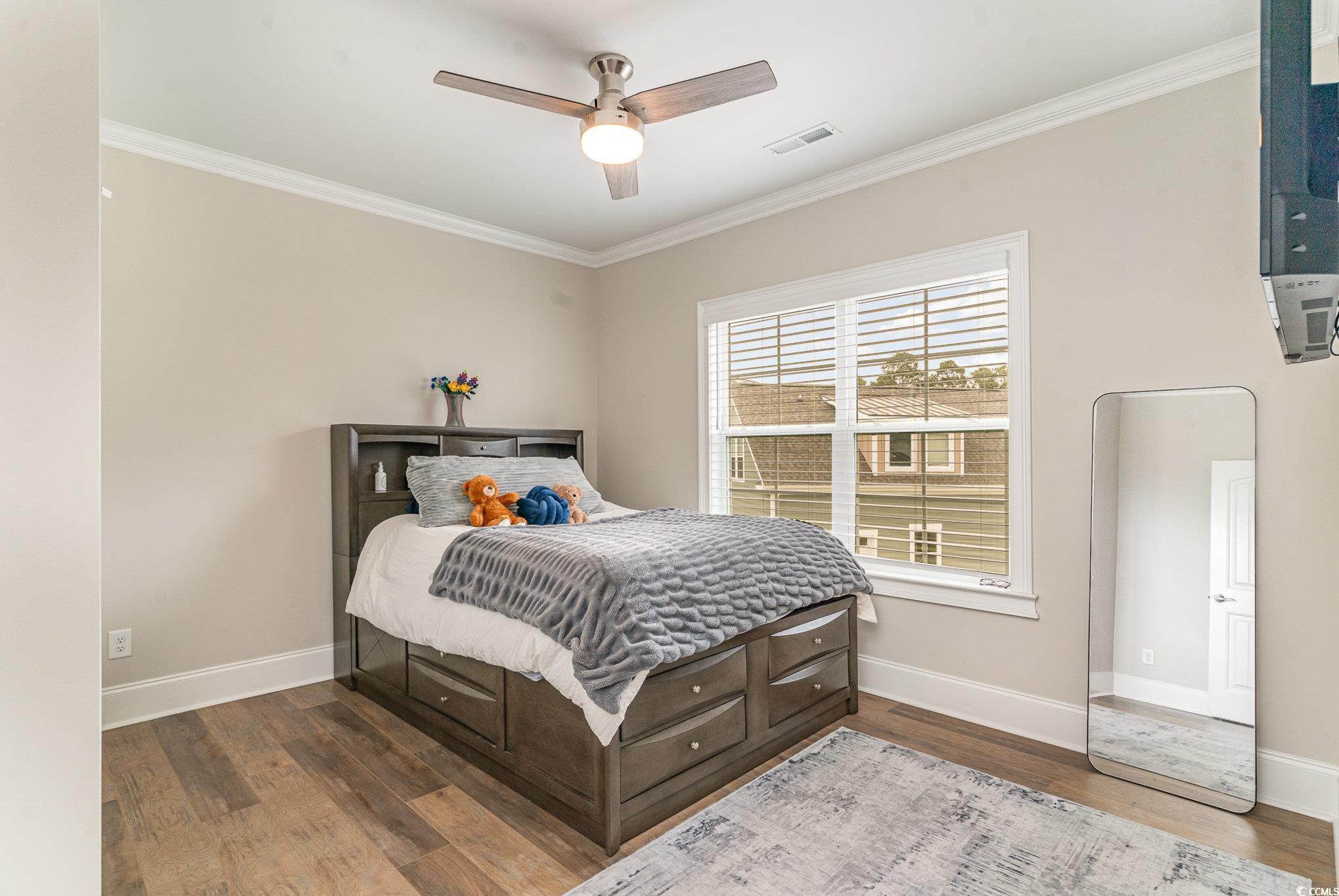 528 Starlit Way Myrtle Beach, SC 29579 - Photo 24 of 40 Bedroom featuring ceiling fan, ornamental molding,