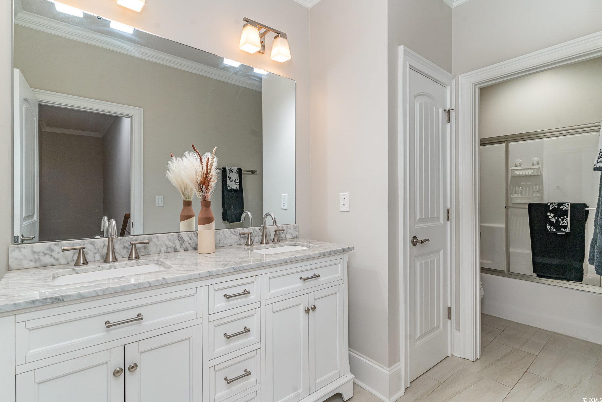 528 Starlit Way Myrtle Beach, SC 29579 - Photo 25 of 40 Bathroom with vanity, ornamental molding, and show