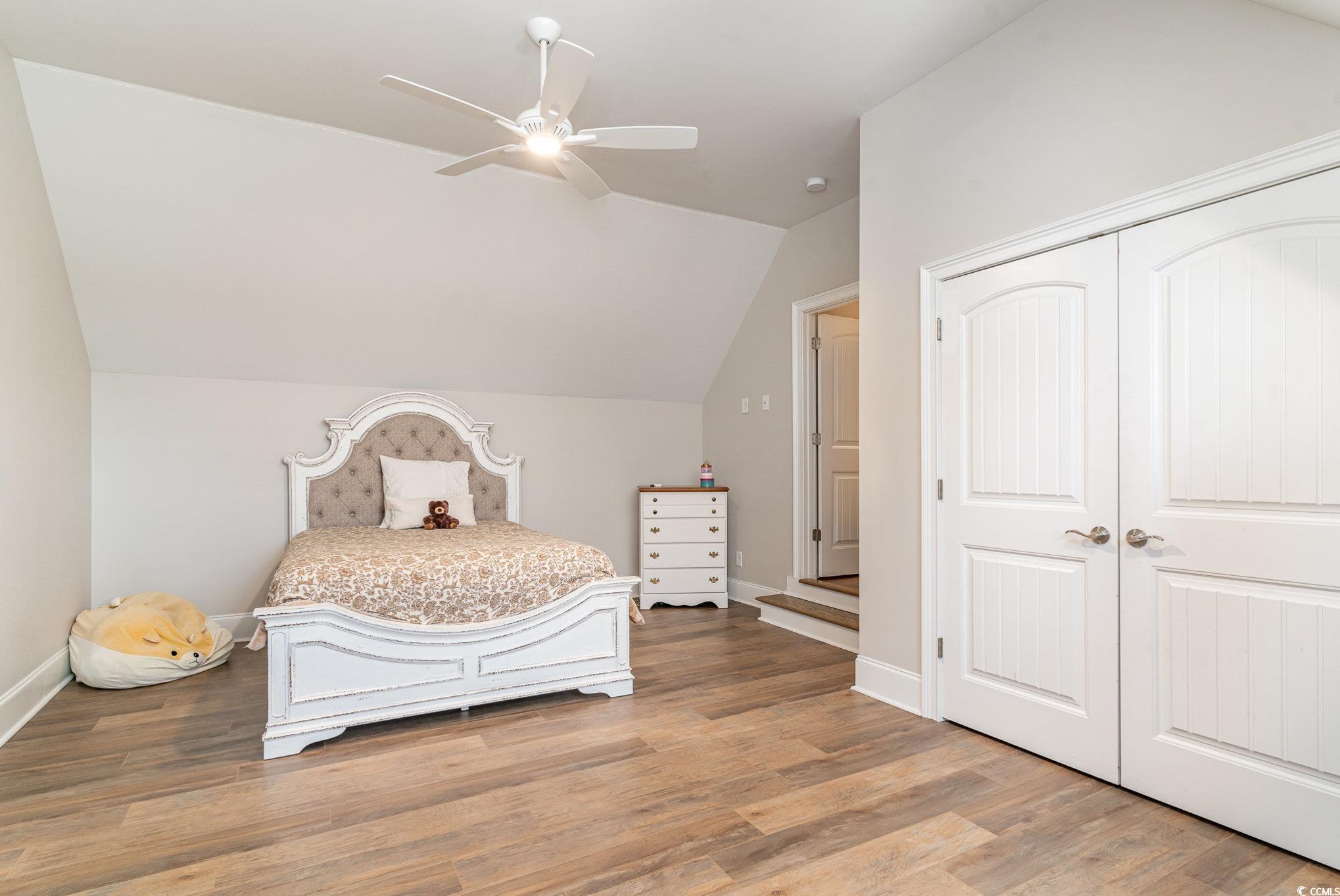 528 Starlit Way Myrtle Beach, SC 29579 - Photo 26 of 40 Bedroom featuring a closet, wood-type flooring, lo