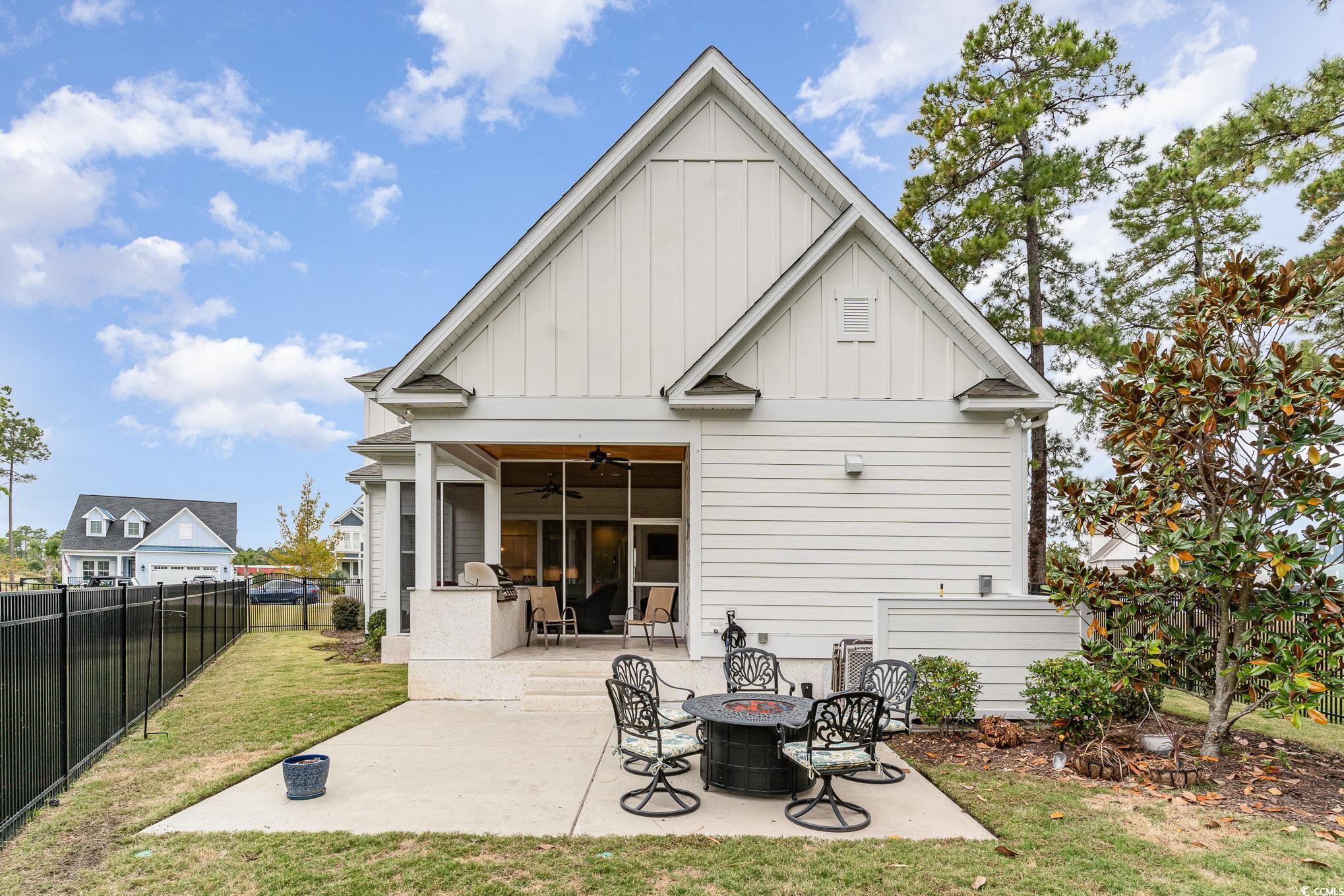 528 Starlit Way Myrtle Beach, SC 29579 - Photo 33 of 40 Back of property featuring a yard, ceiling fan, an