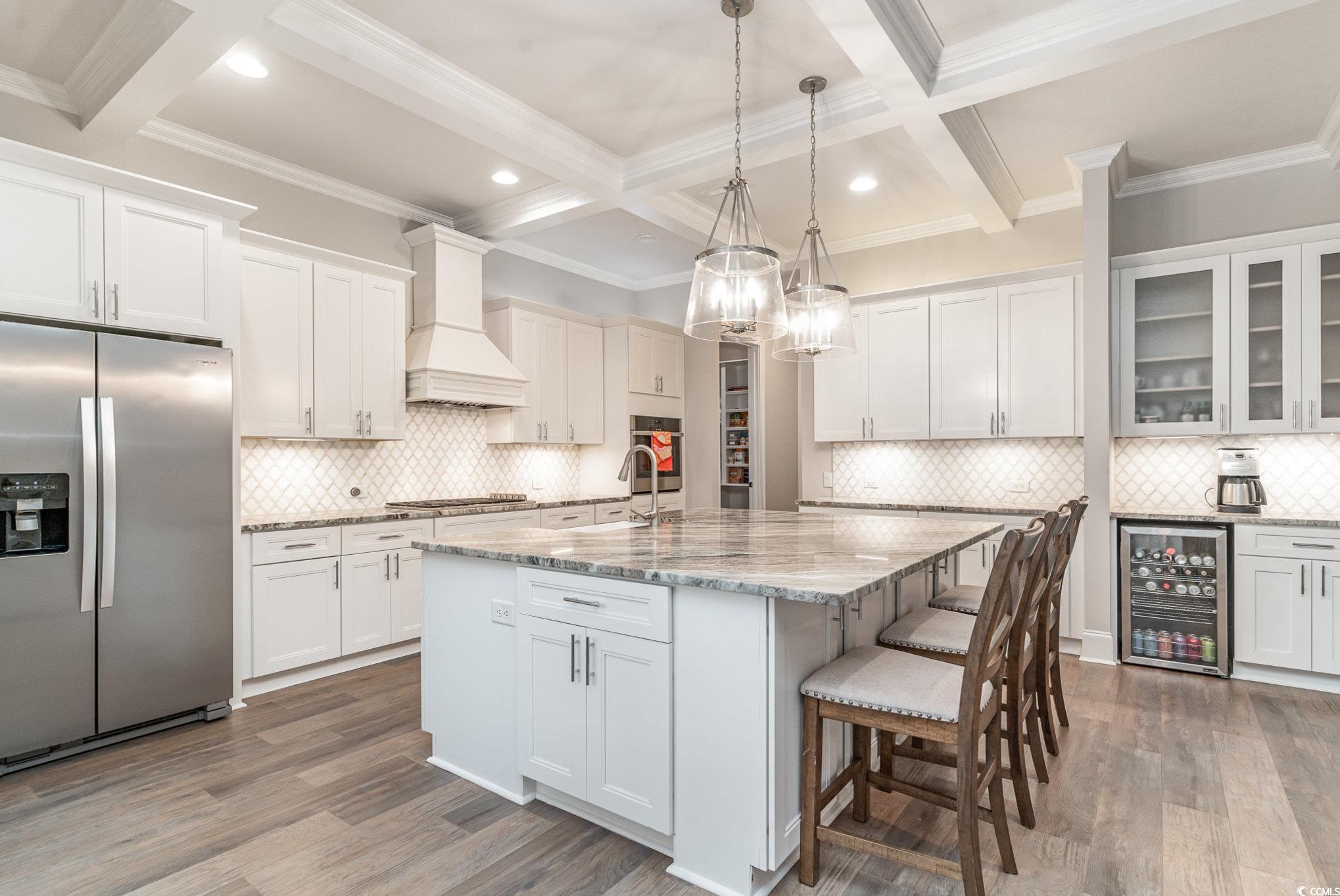 528 Starlit Way Myrtle Beach, SC 29579 - Photo 8 of 40 Kitchen with custom range hood, stainless steel ap