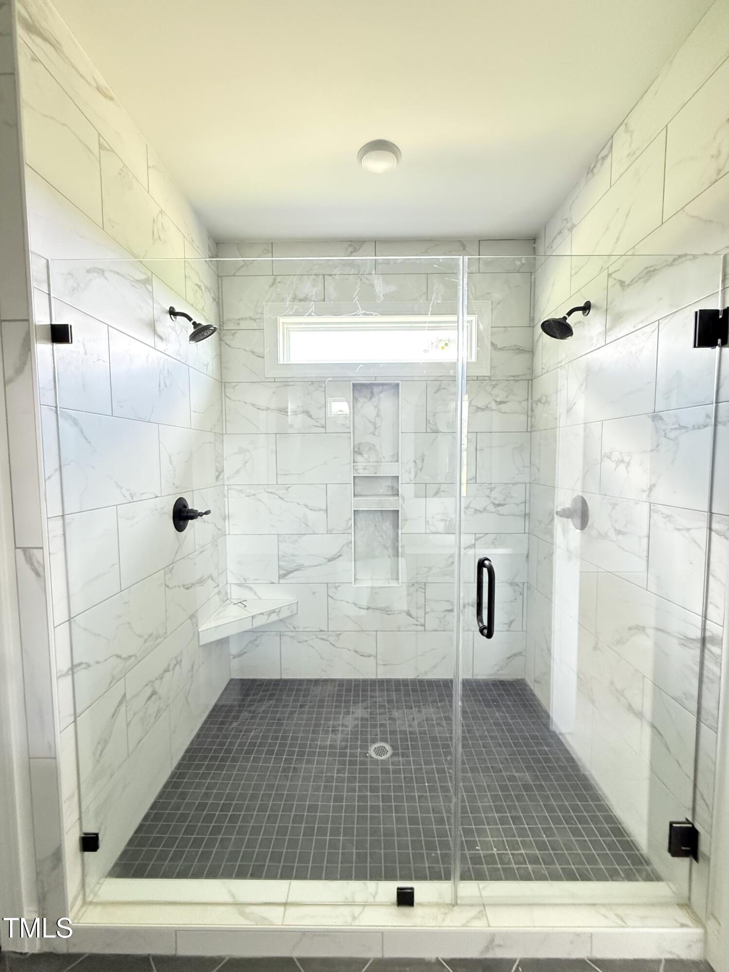 6930 Fire Tower Road Bailey, NC 27807 - Photo 16 of 33 Spacious Tiled, Dual Shower Heads and transom window to let in natural light.