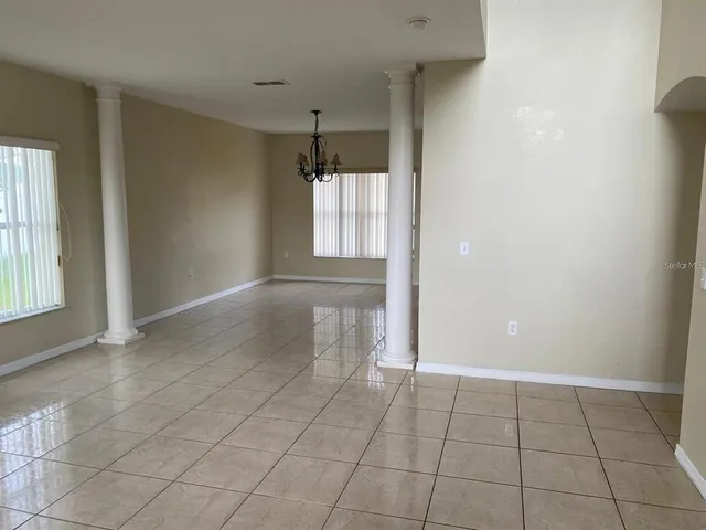 a view of an empty room and window