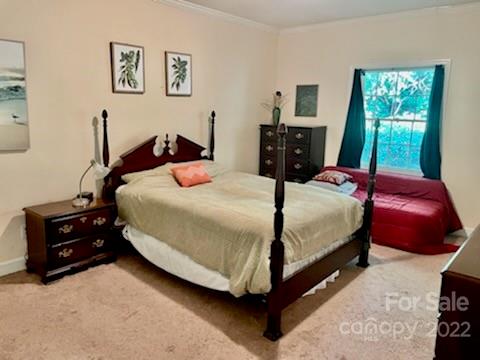 5931 Quail Hollow Road, Unit G Charlotte, NC 28210 - Photo 5 of 7 a bedroom with a bed and window