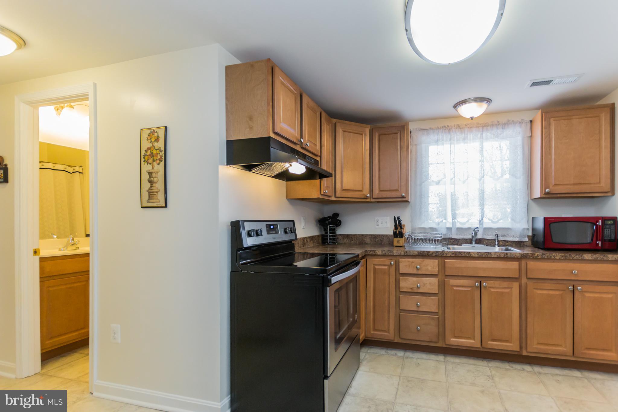 1336 Tenbrook Road Odenton, MD 21113 - Photo 14 of 30 a kitchen with cabinets appliances and a window