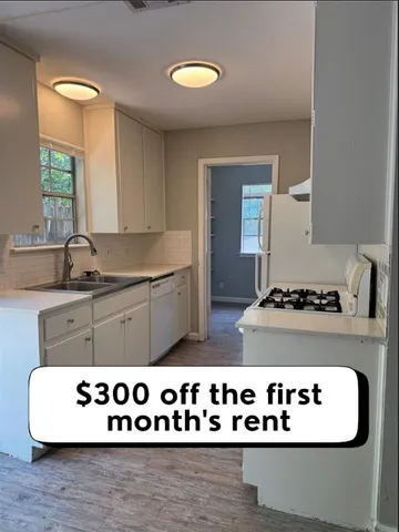 a kitchen with a stove and a sink